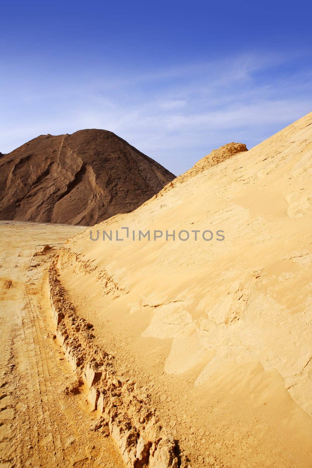 sand quarry mounds of varied construction sands color outdoor