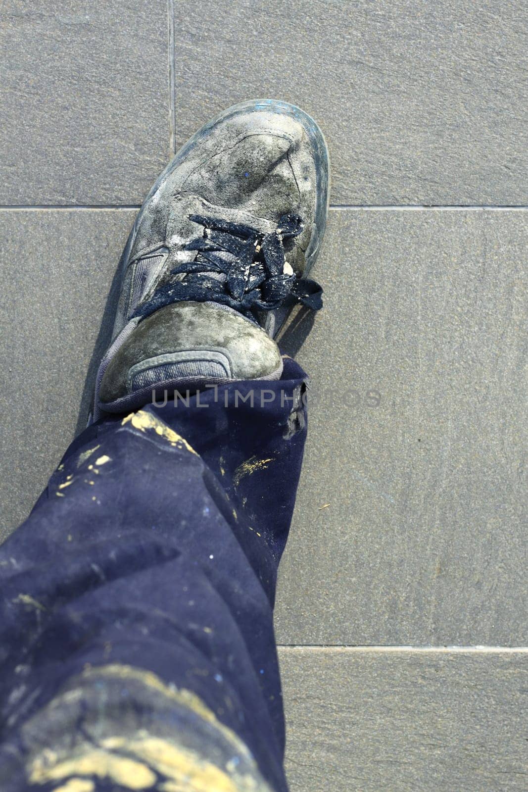 manual man worker old shoes detail high view dirty pants