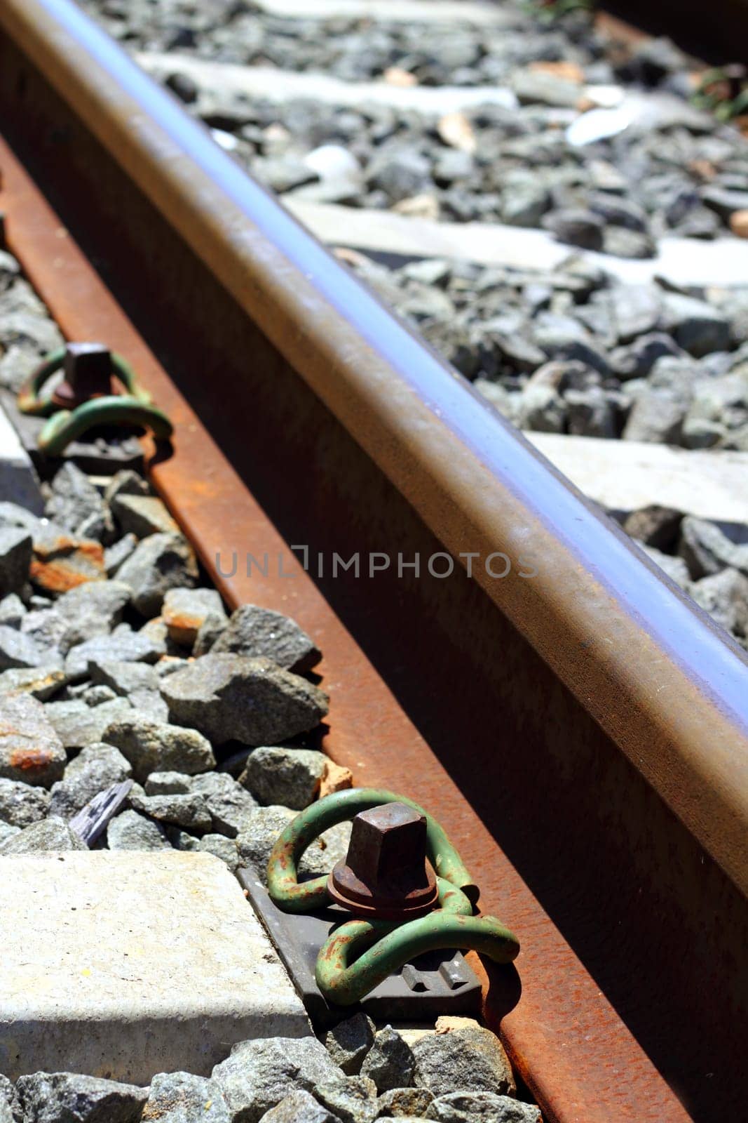 iron rusty train railway detail over dark stones rail way