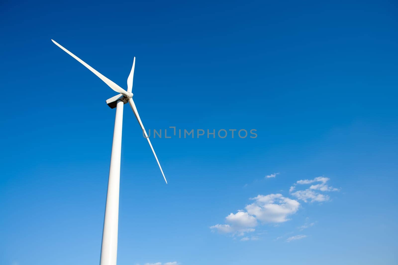 aerogenerator windmill in blue sky background