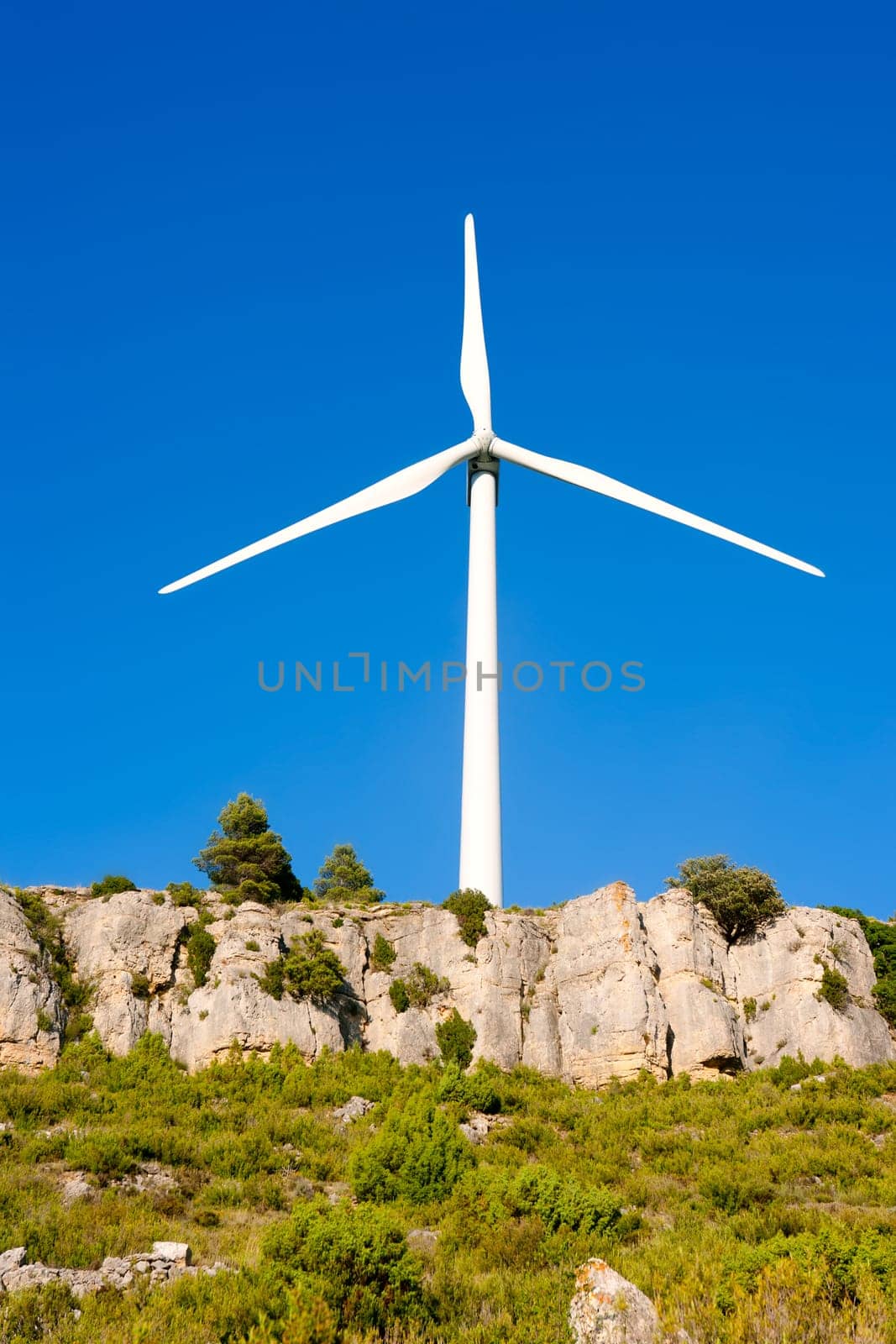 aerogenerator windmill in rocky mountain peak