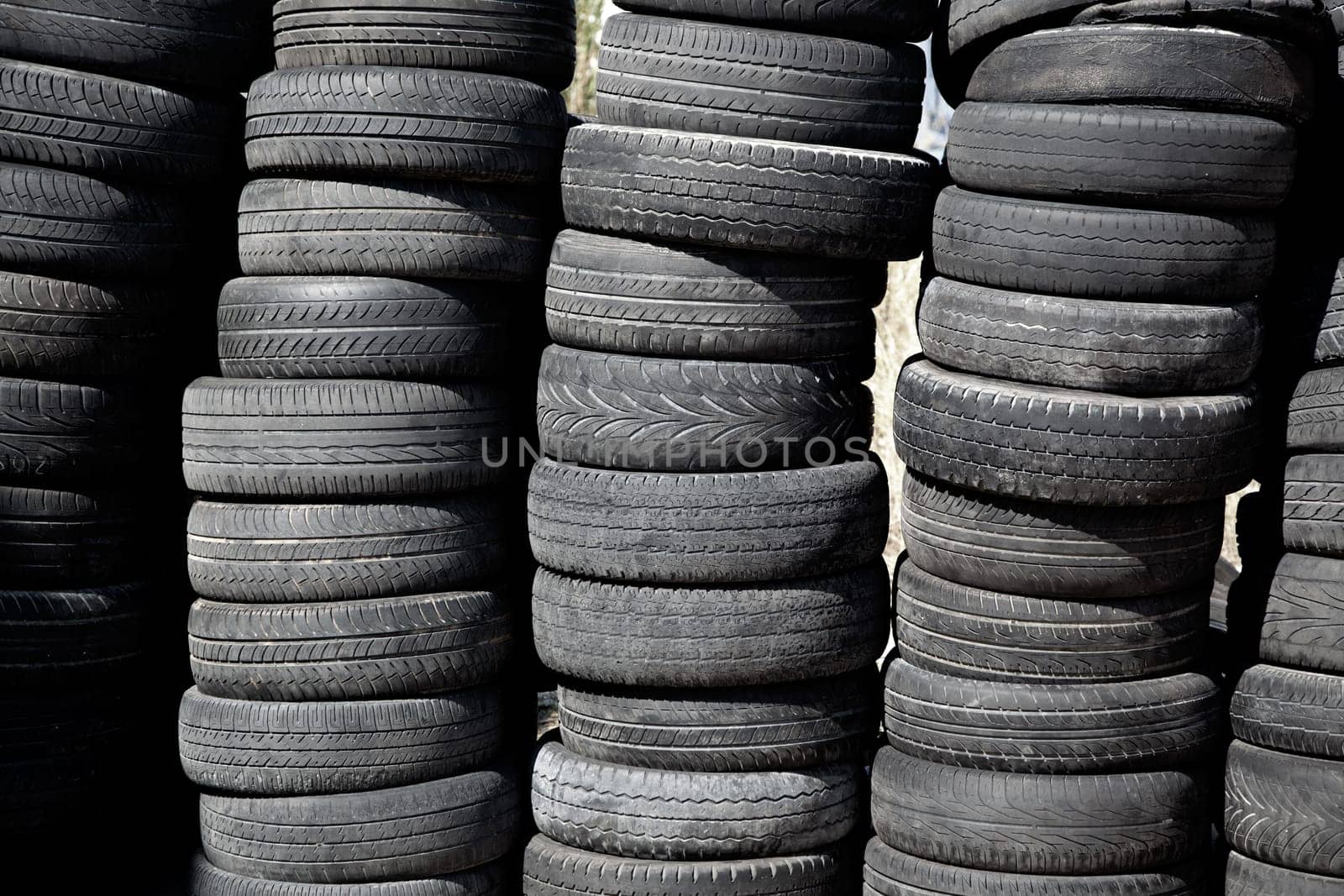 car tires used  pneus stacked in rows for recycle