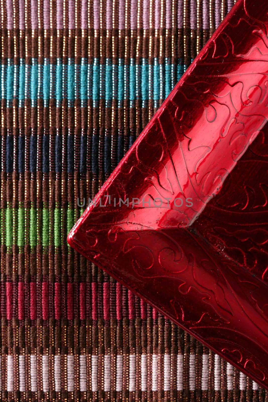 Red frame corner over multi color fabric tablecloth