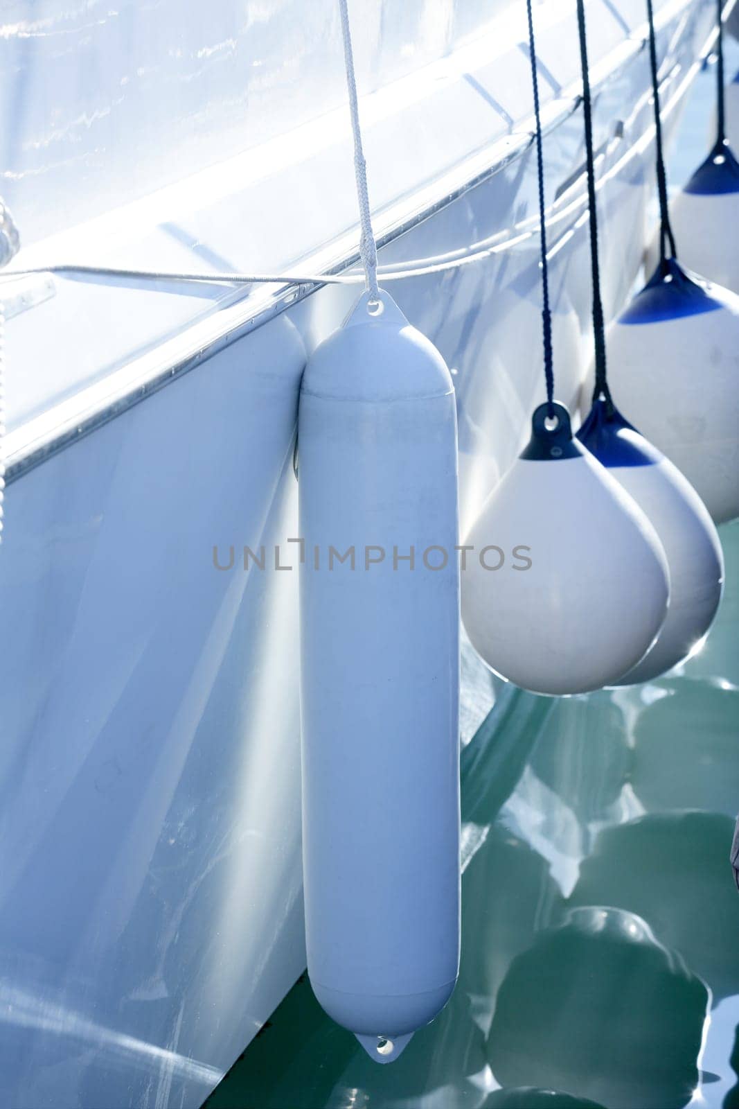 Boat white fender details on mediterranean marina, Spain