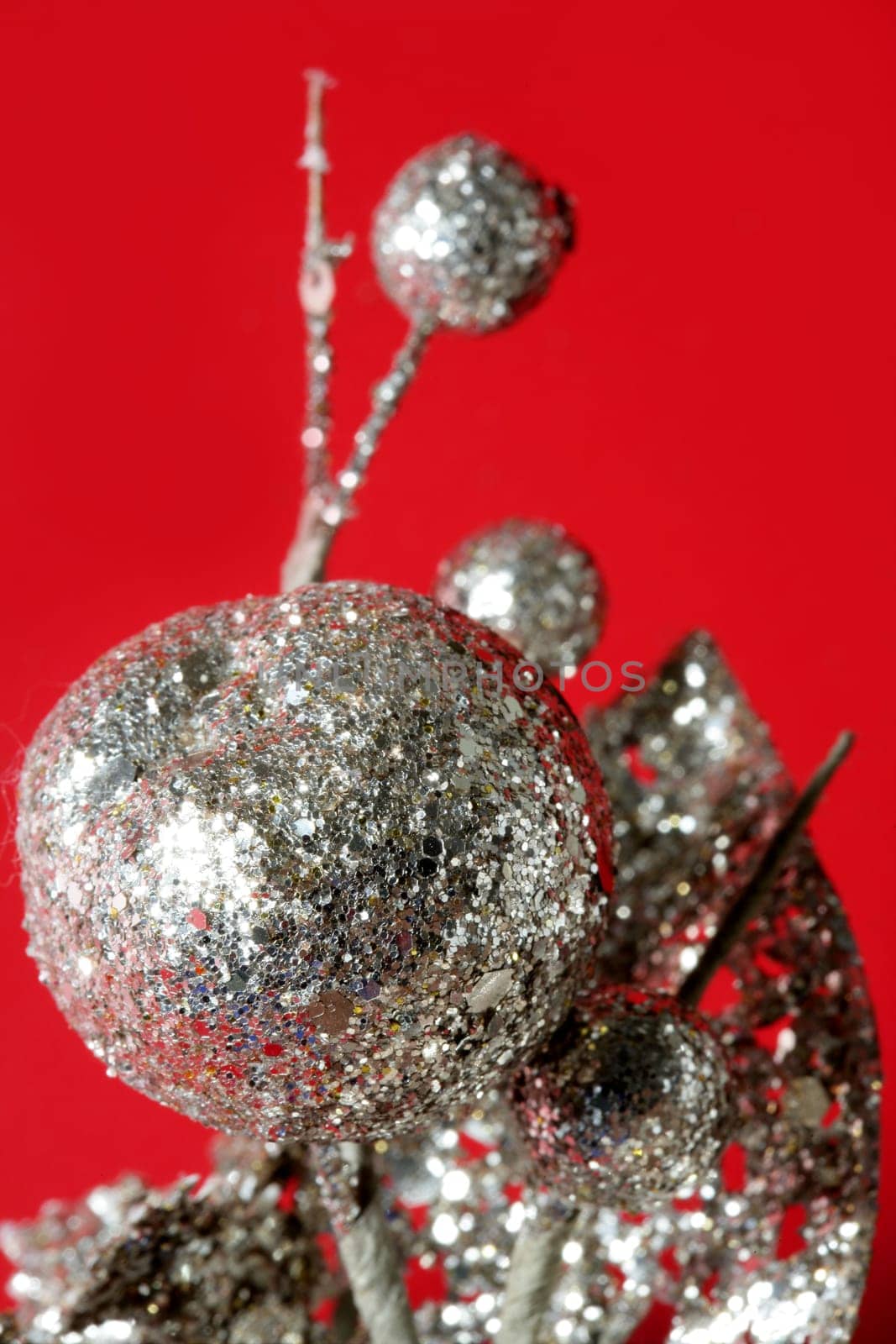 Christmas decoration detail over red studio background