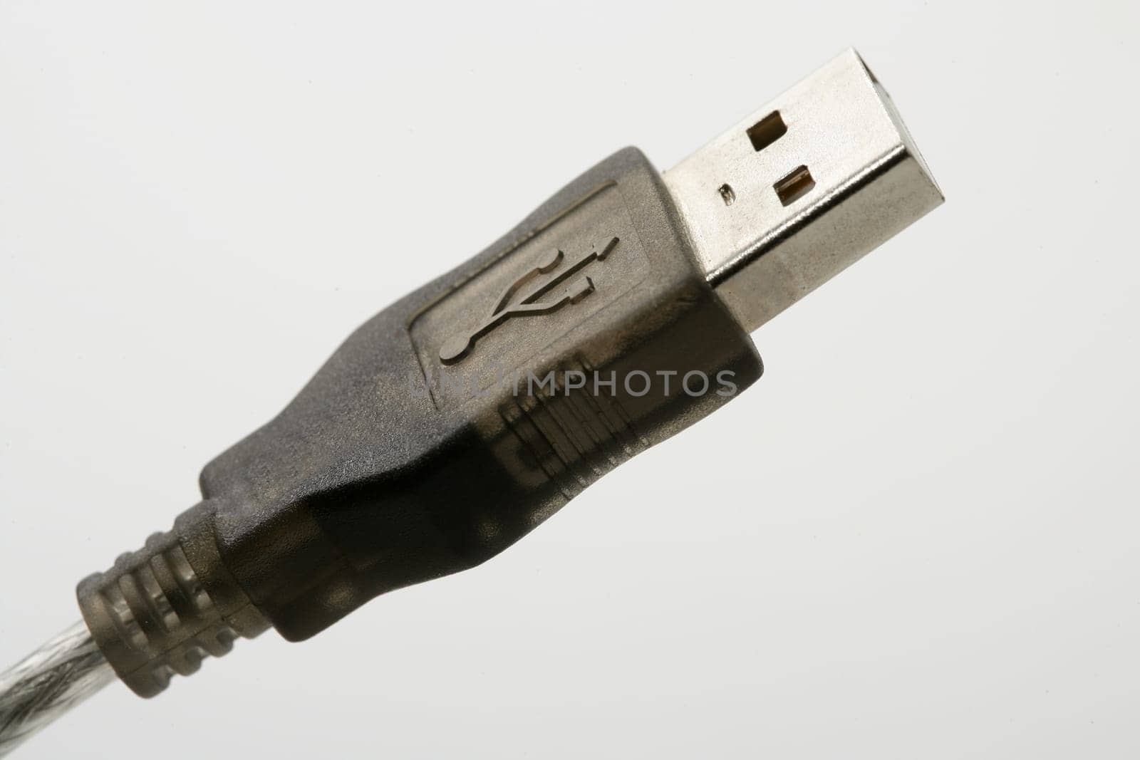 USB connection plug macro detail closeup over white background