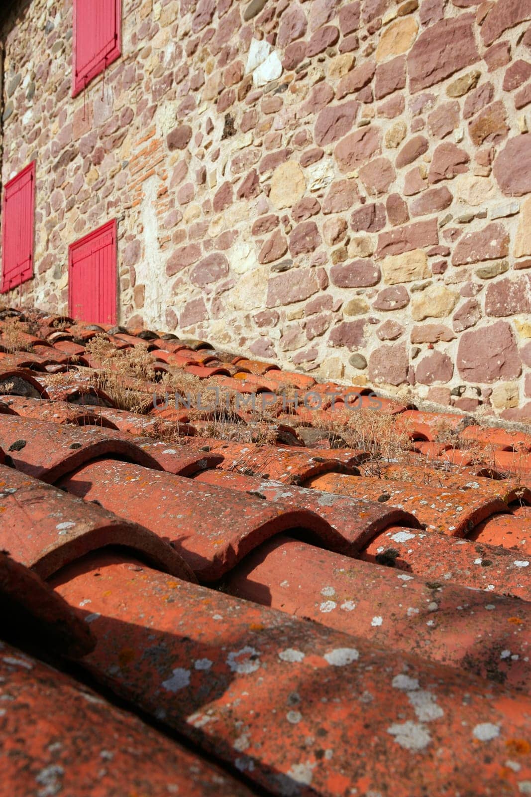 Architectural detail of grunge aged roof clay tiles