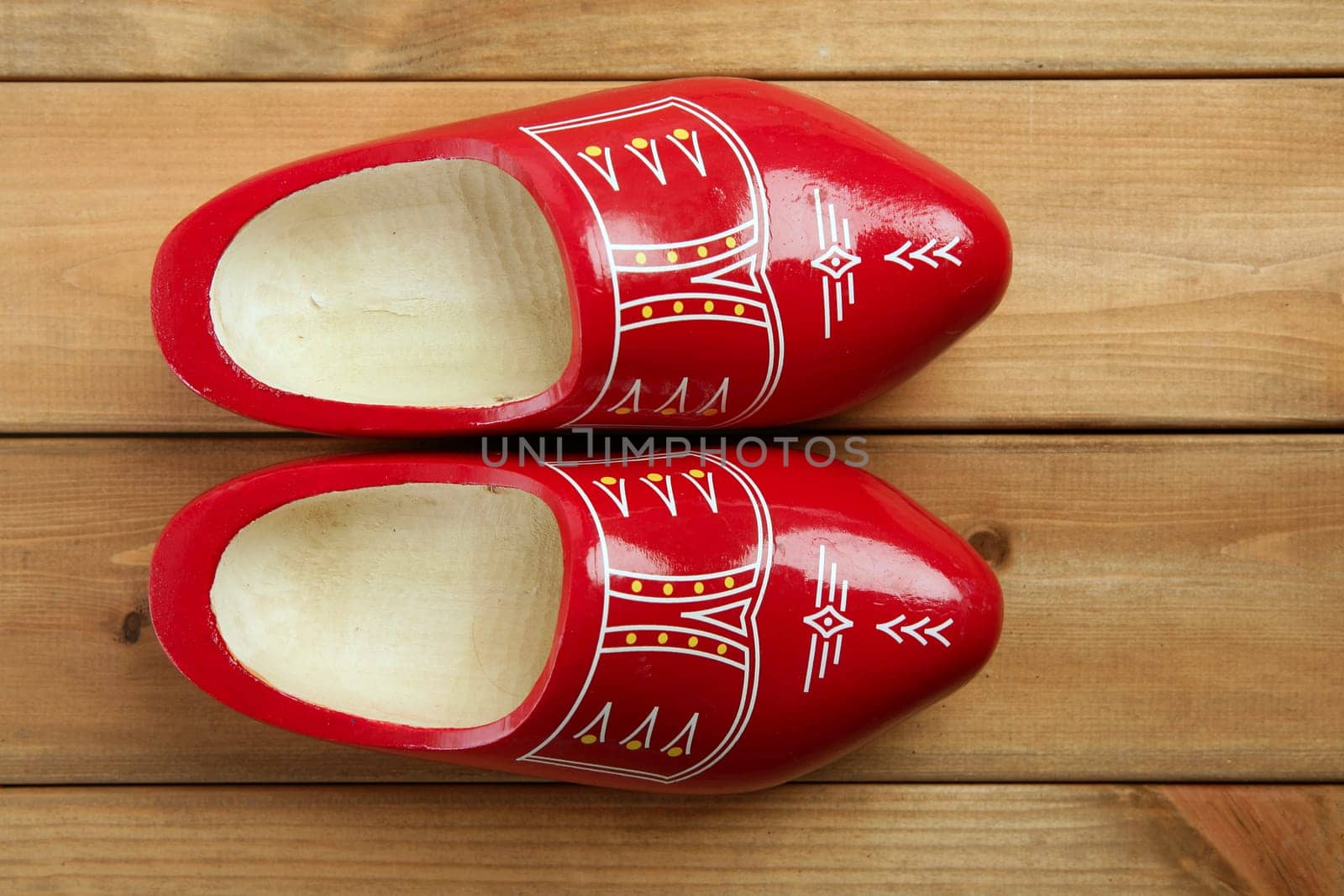 Dutch Holland red wooden shoes on wood background