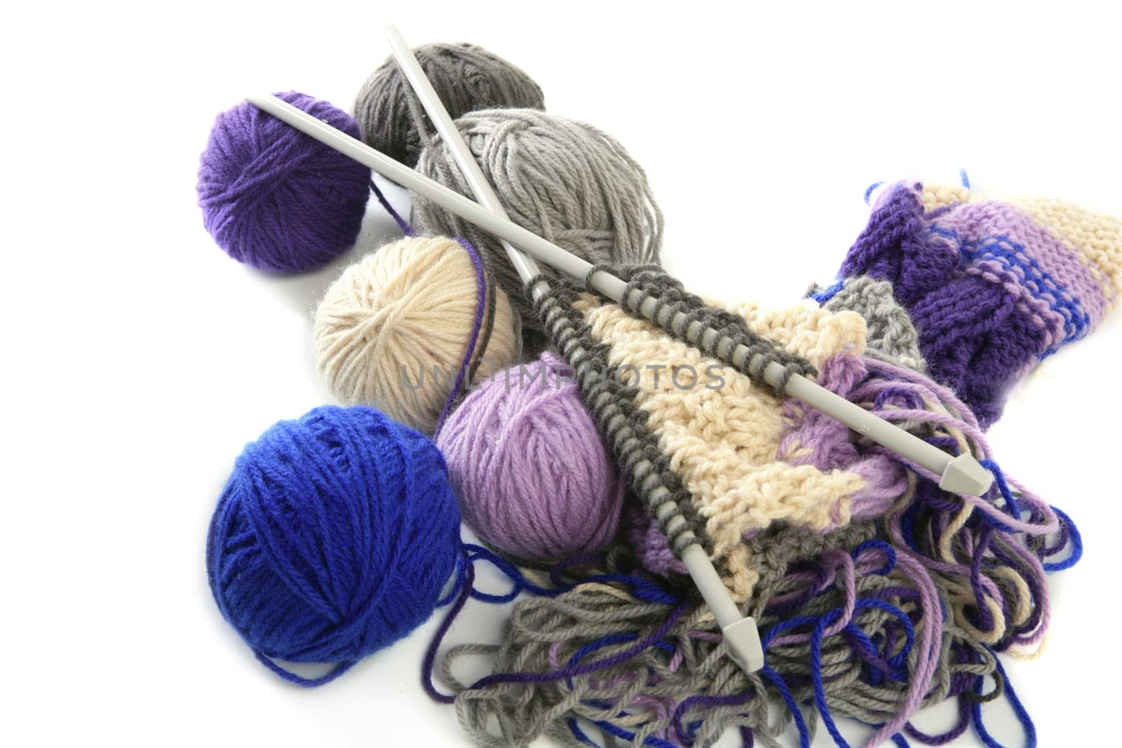 colorful knitting tools with wool thread balls