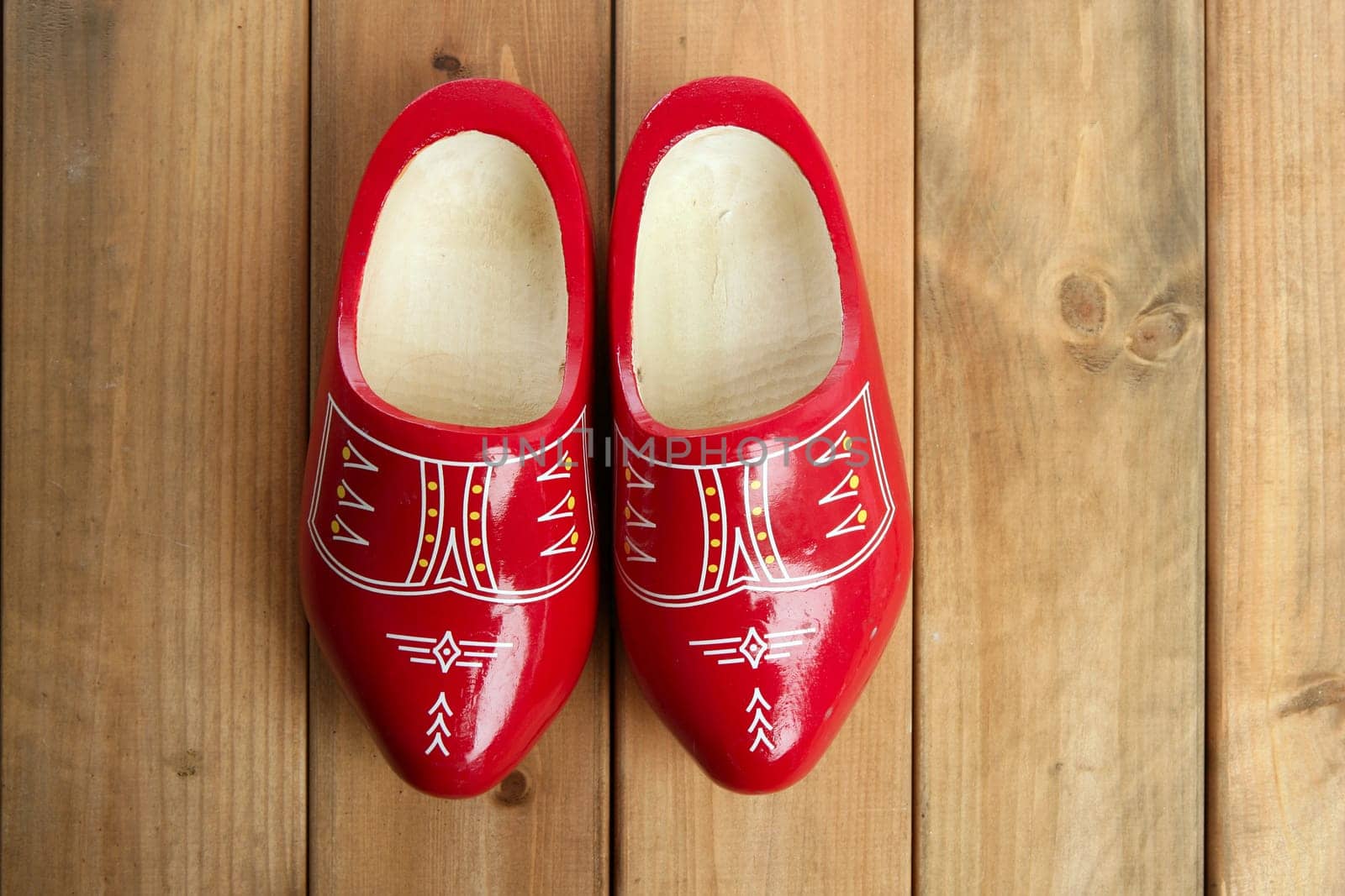 Dutch Holland red wooden shoes on wood background