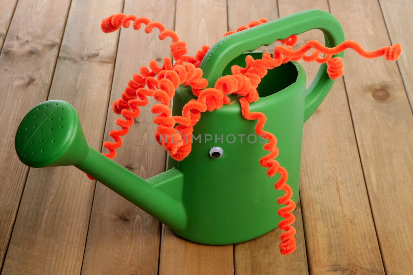 Different handmade garden can toy face and funny red hair