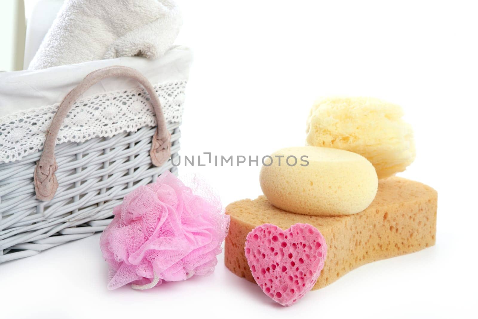 Toiletries stuff sponge gel shampoo and bath towels on white background