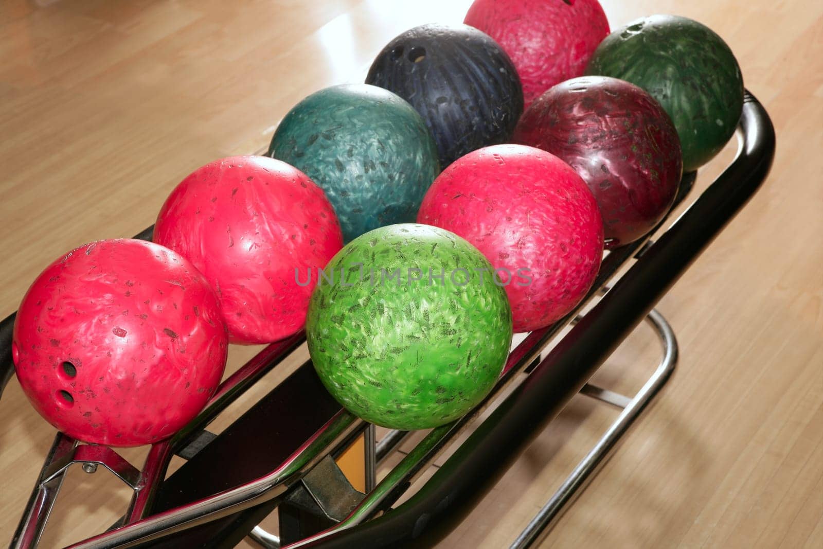 Bowling balls red green closeup row detail