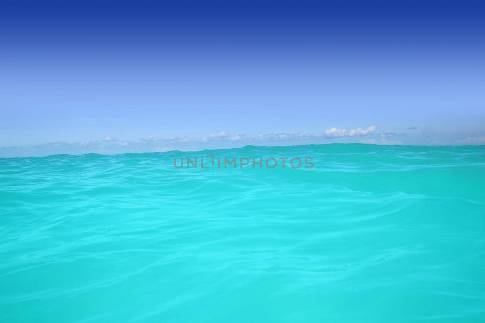 caribbean wave turquoise water horizon line and blue sky