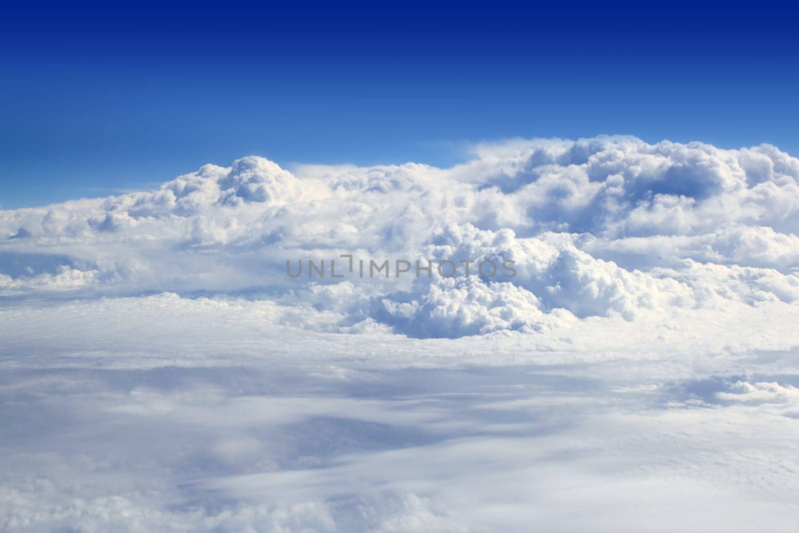 blue sky high view from airplane clouds like a mountain shapes