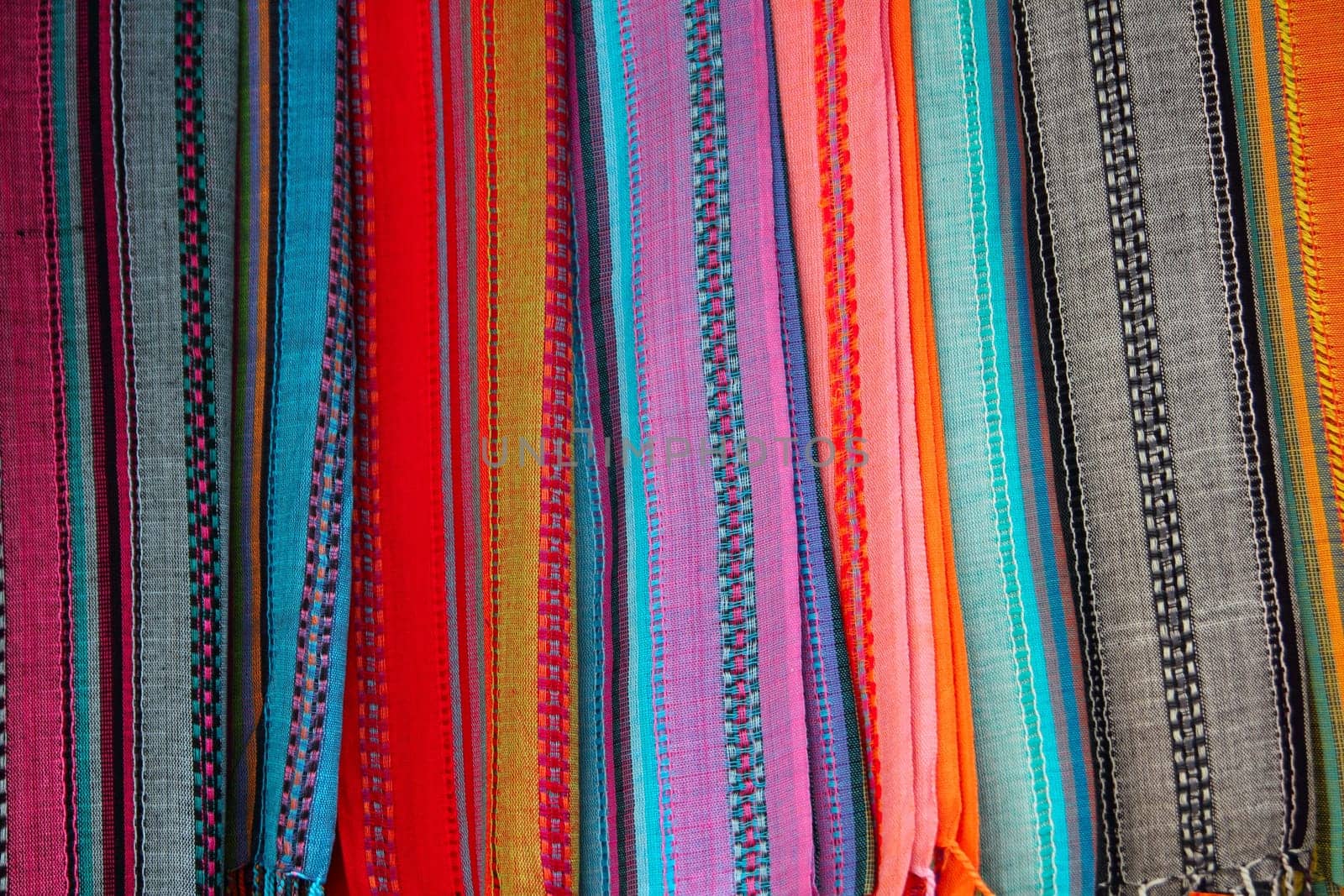 Indian colorful scarf in a row with vivid colors stripes