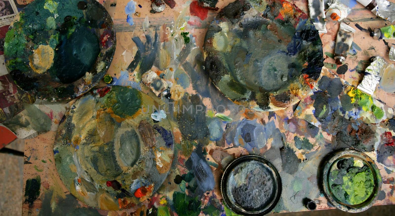 Artist studio painted dirty table, colored in many colors