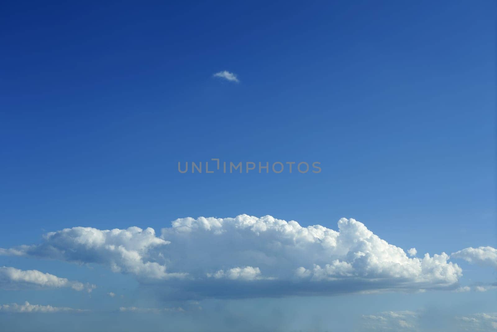 Blue sky with white clouds horizontal image