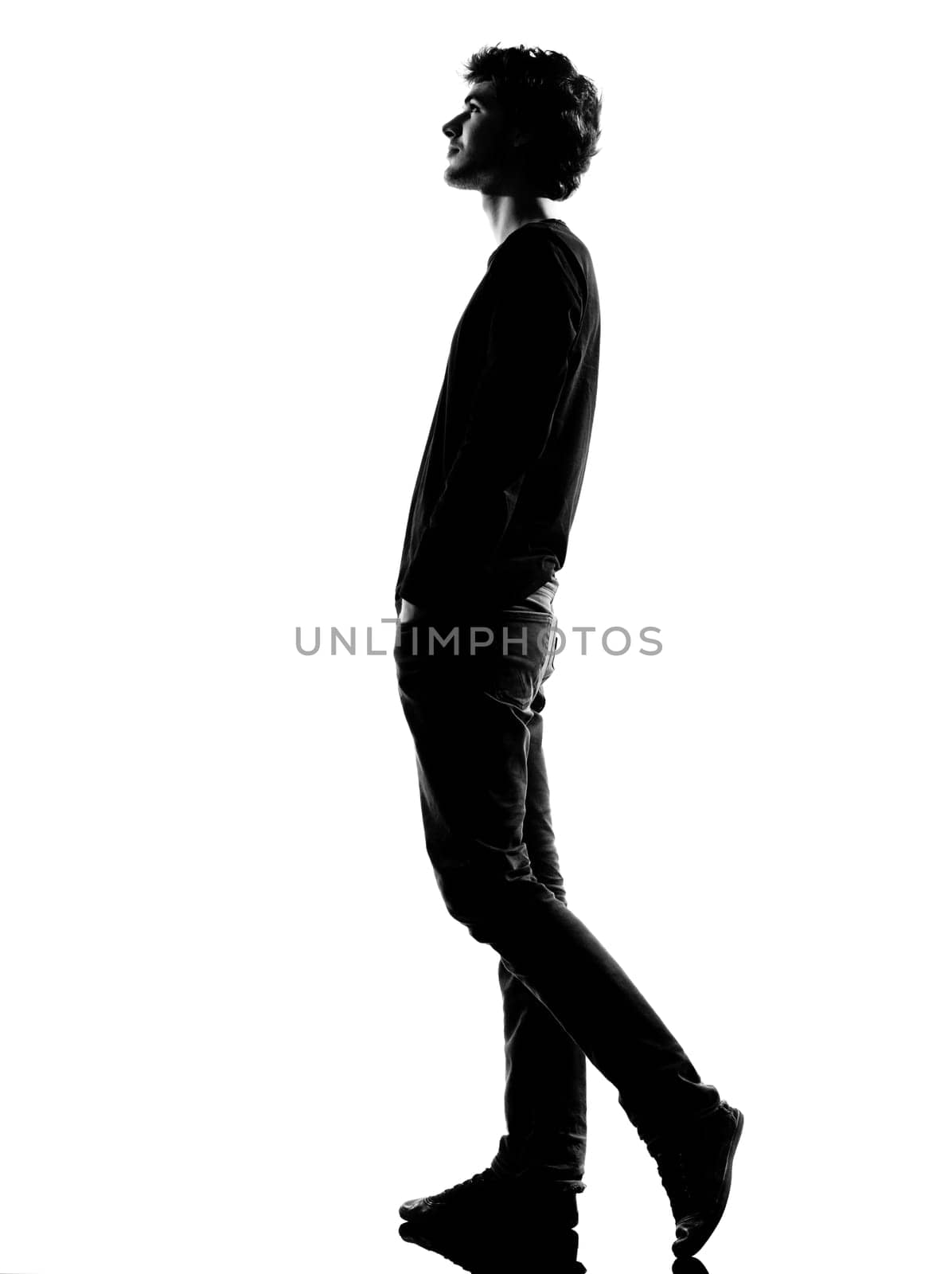 young man  walking silhouette in studio isolated on white background