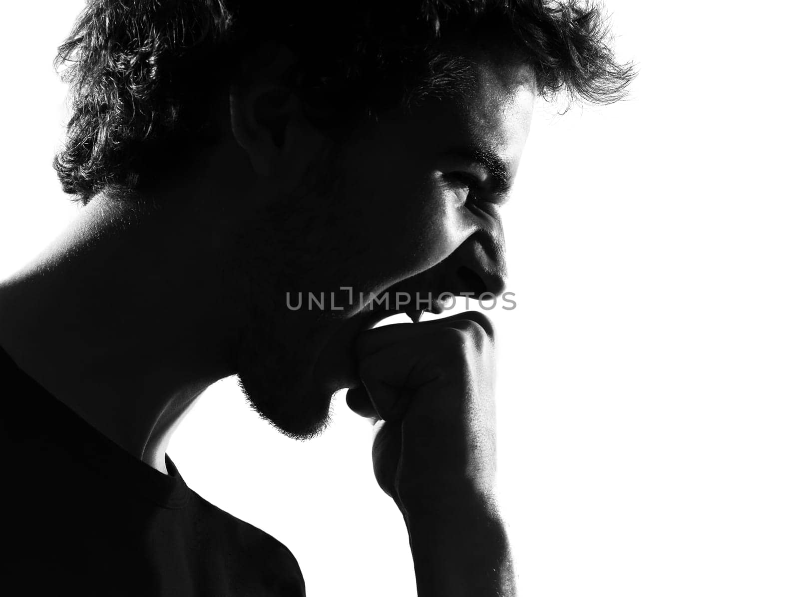 young man silhouette in studio isolated on white background