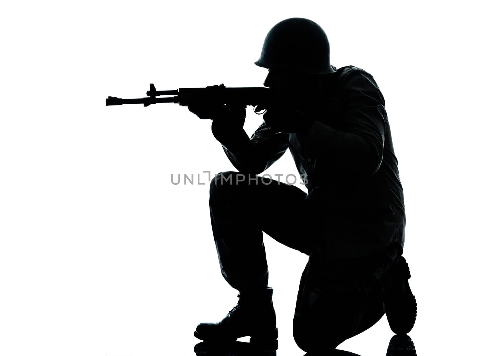 one caucasian army soldier man shooting on studio isolated on white background