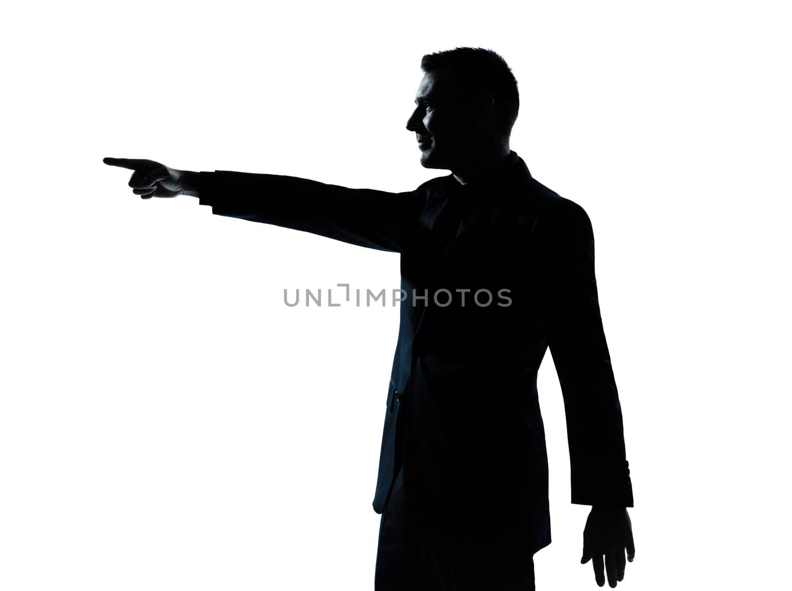 one caucasian business man poiting portrait silhouette in studio isolated on white background