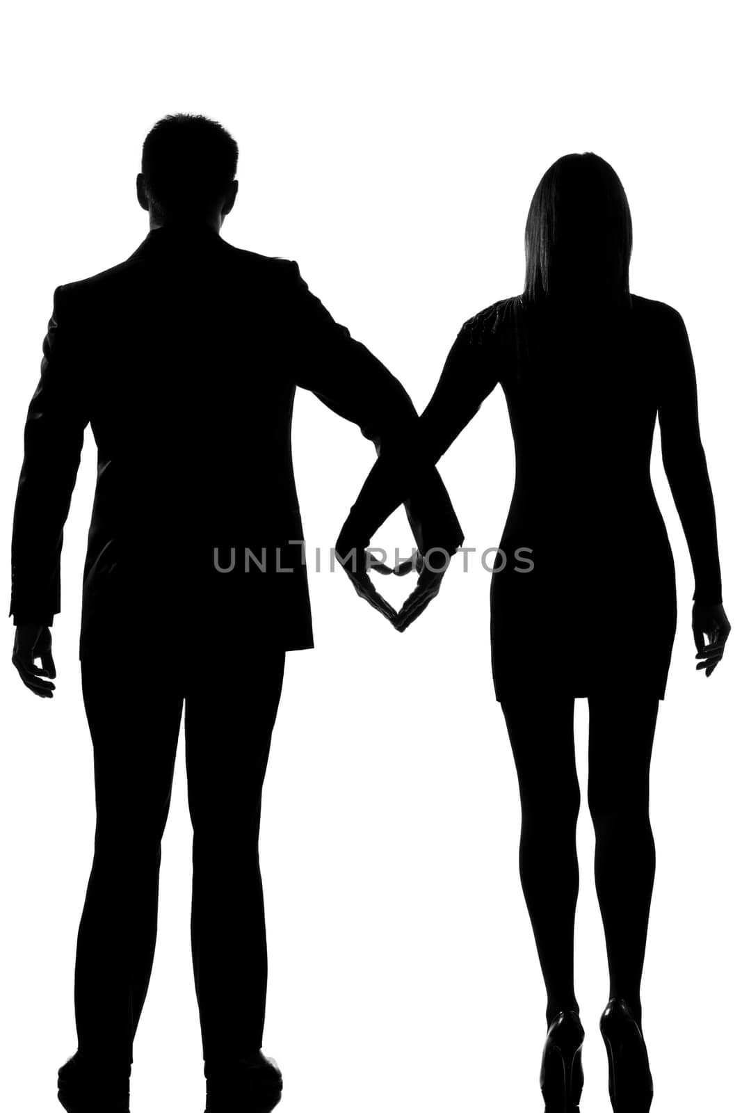 one lovers caucasian couple man and woman walking hand in hand in studio silhouette isolated on white background