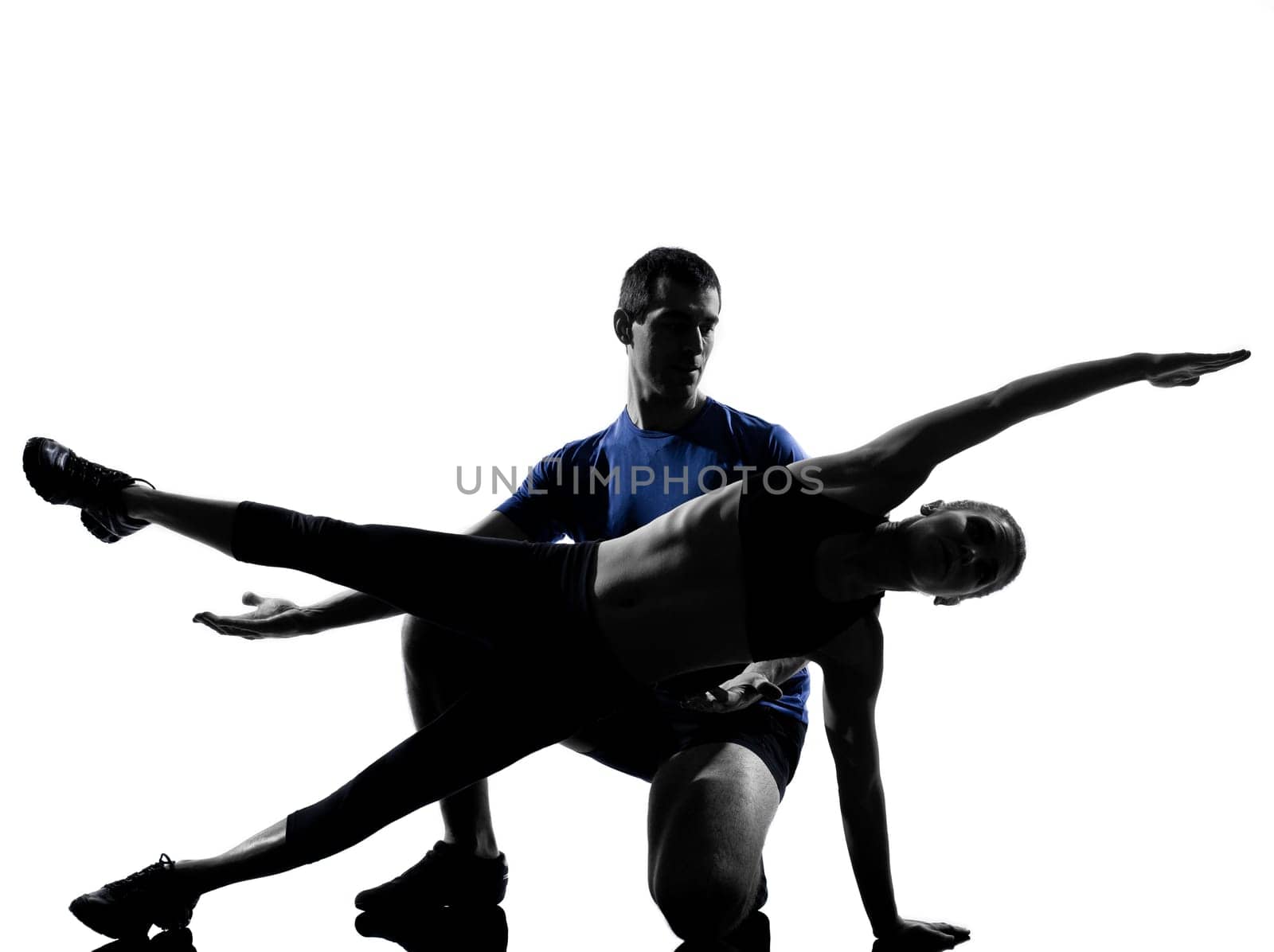 couple woman man exercising workout fitness aerobics posture in silhouette studio isolated on white background