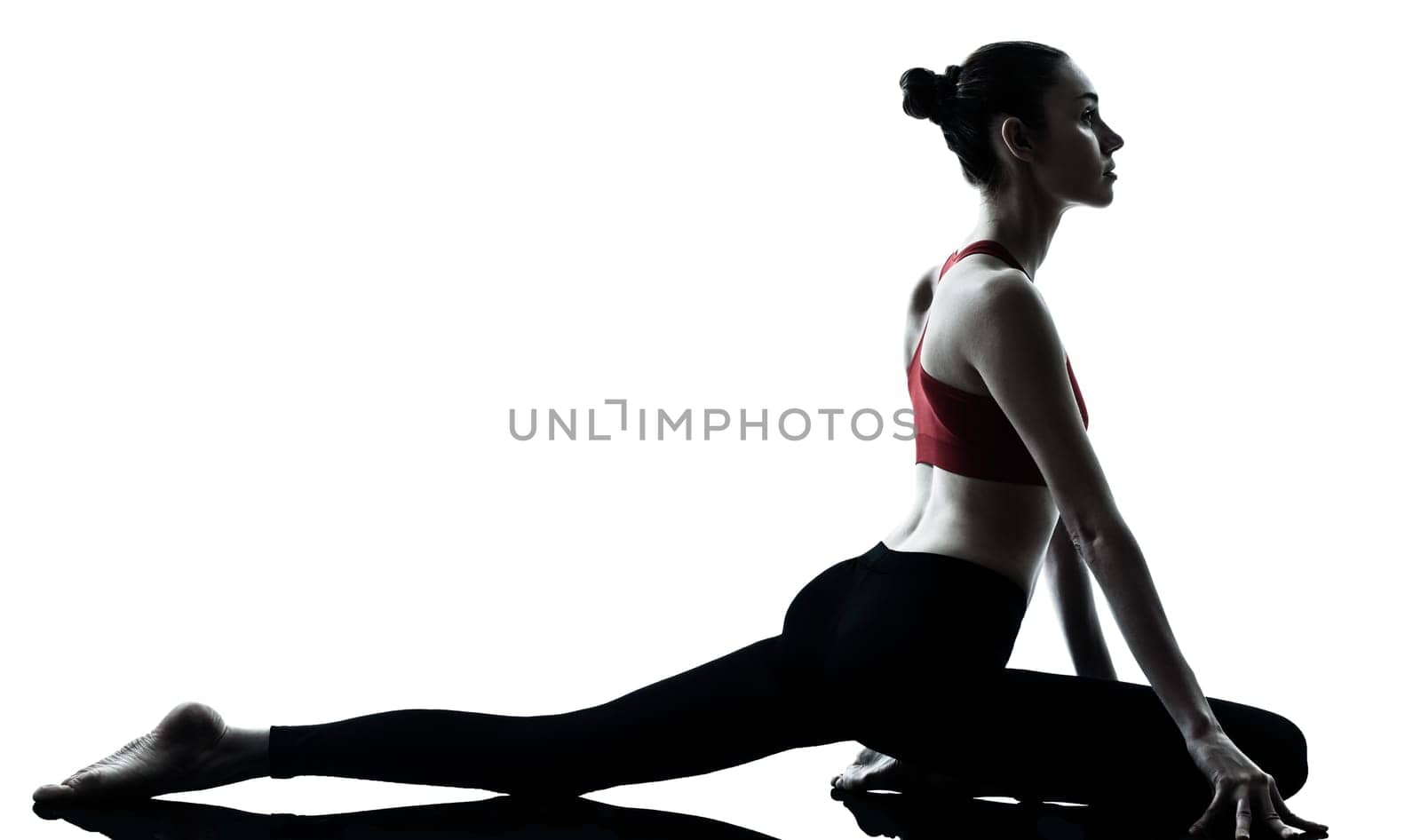 one caucasian woman exercising yoga in silhouette studio isolated isolated on white background