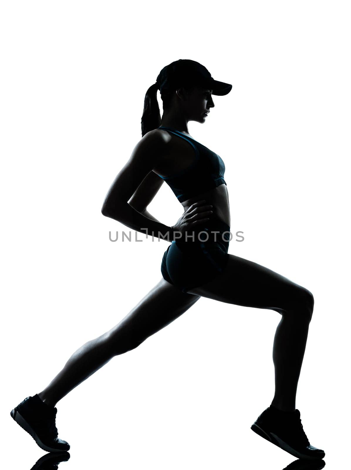 one caucasian woman runner jogger  stretching warm up in silhouette studio isolated on white background