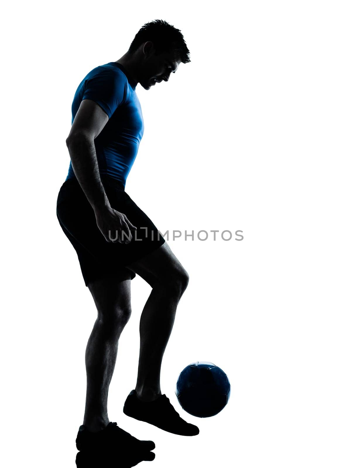 one caucasian man playing soccer juggling football player silhouette  in studio isolated on white background