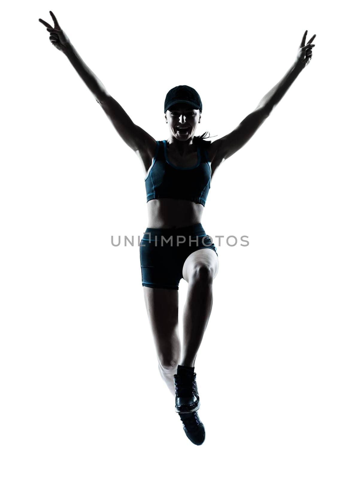 one caucasian woman runner jogger victorious jumping in silhouette studio isolated on white background