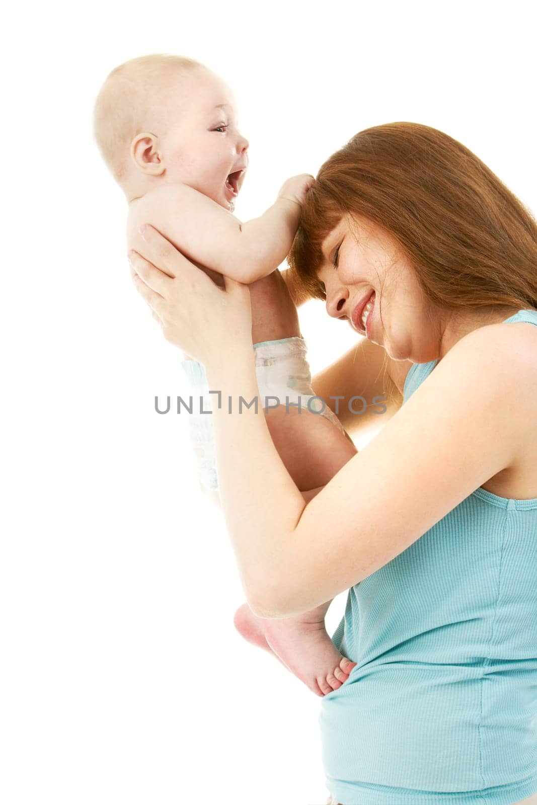 Image of funny baby pulling his mother hair in isolation