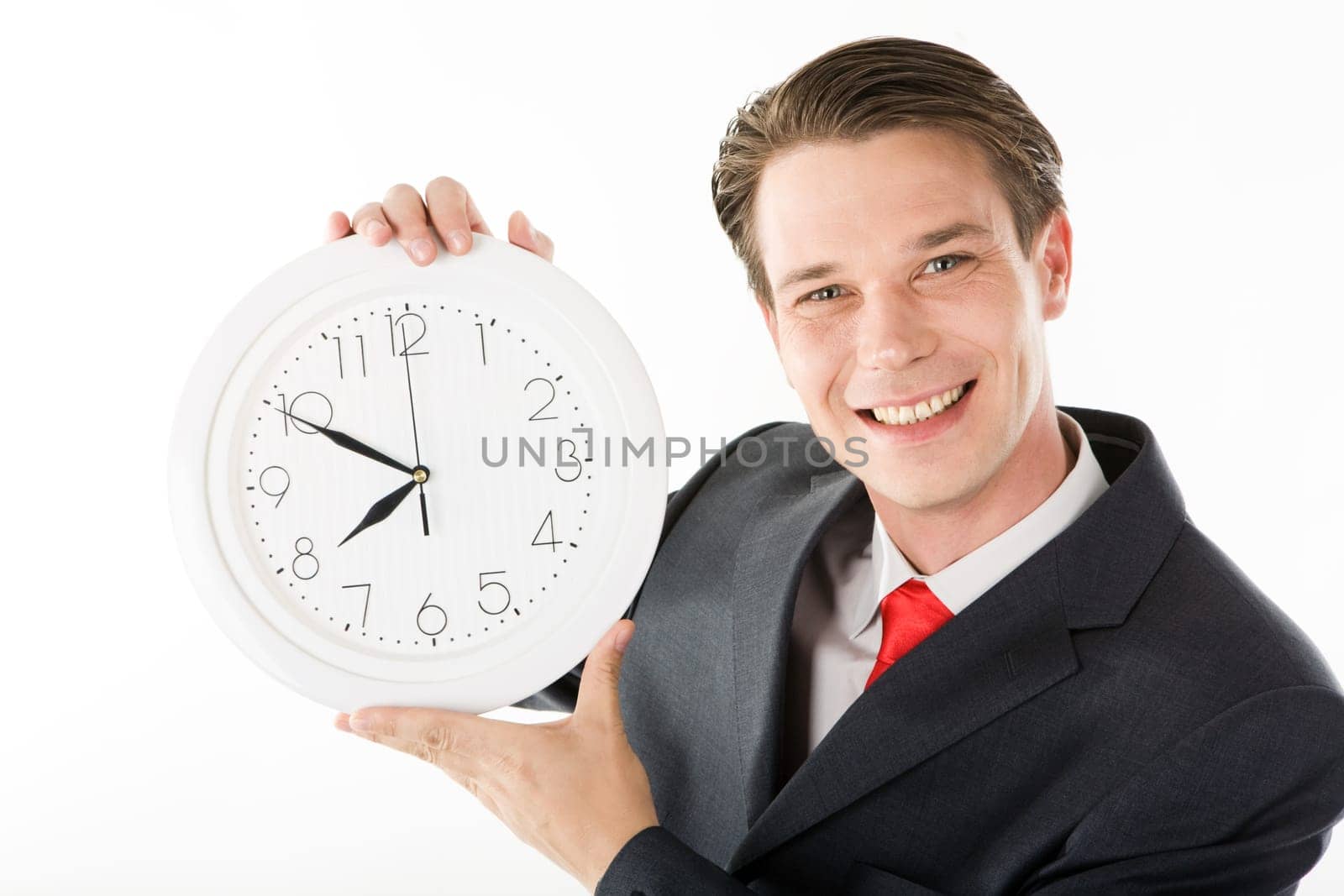 Photo of smiling employer with clock in hands looking at camera