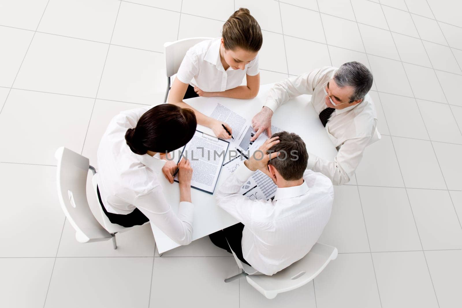 Above view of business workteam thinking about new project at meeting