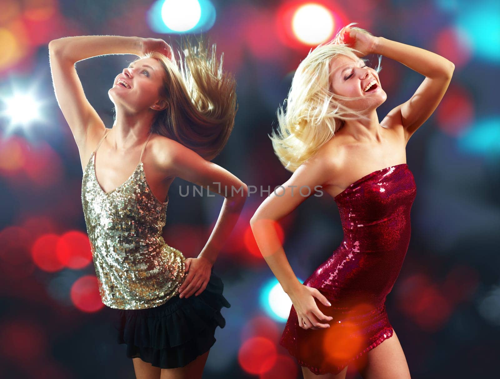 Two energetic girls dancing isolated