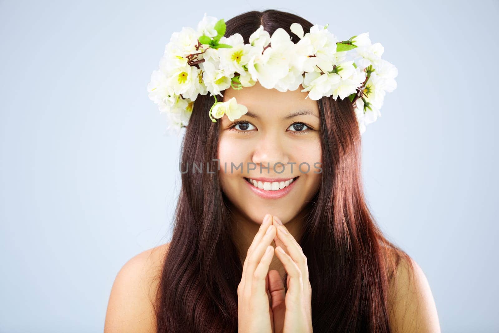 Image of happy female wearing floral wreath on head