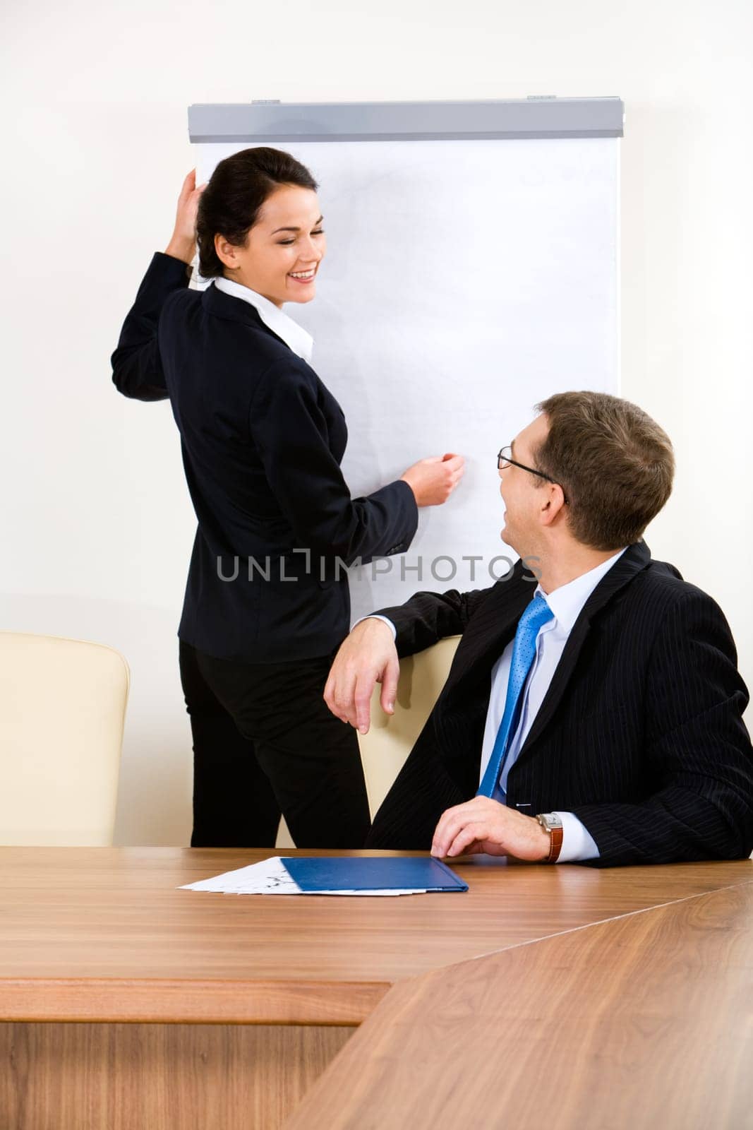 Portrait of pretty student explaining a educational subject to her teacher