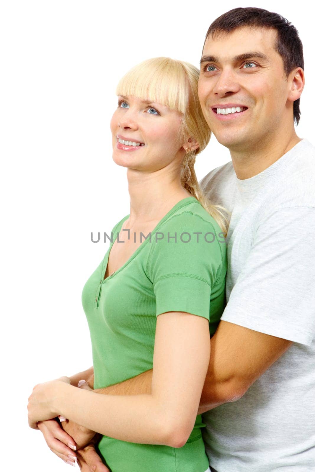 Portrait of passionate man hugging his girlfriend and looking up together