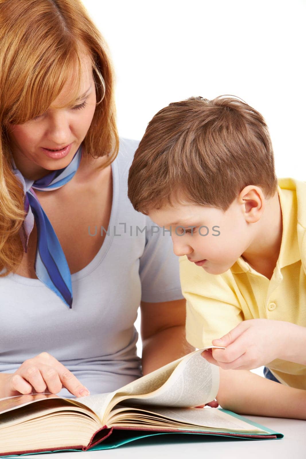 Portrait of woman and boy reading book together