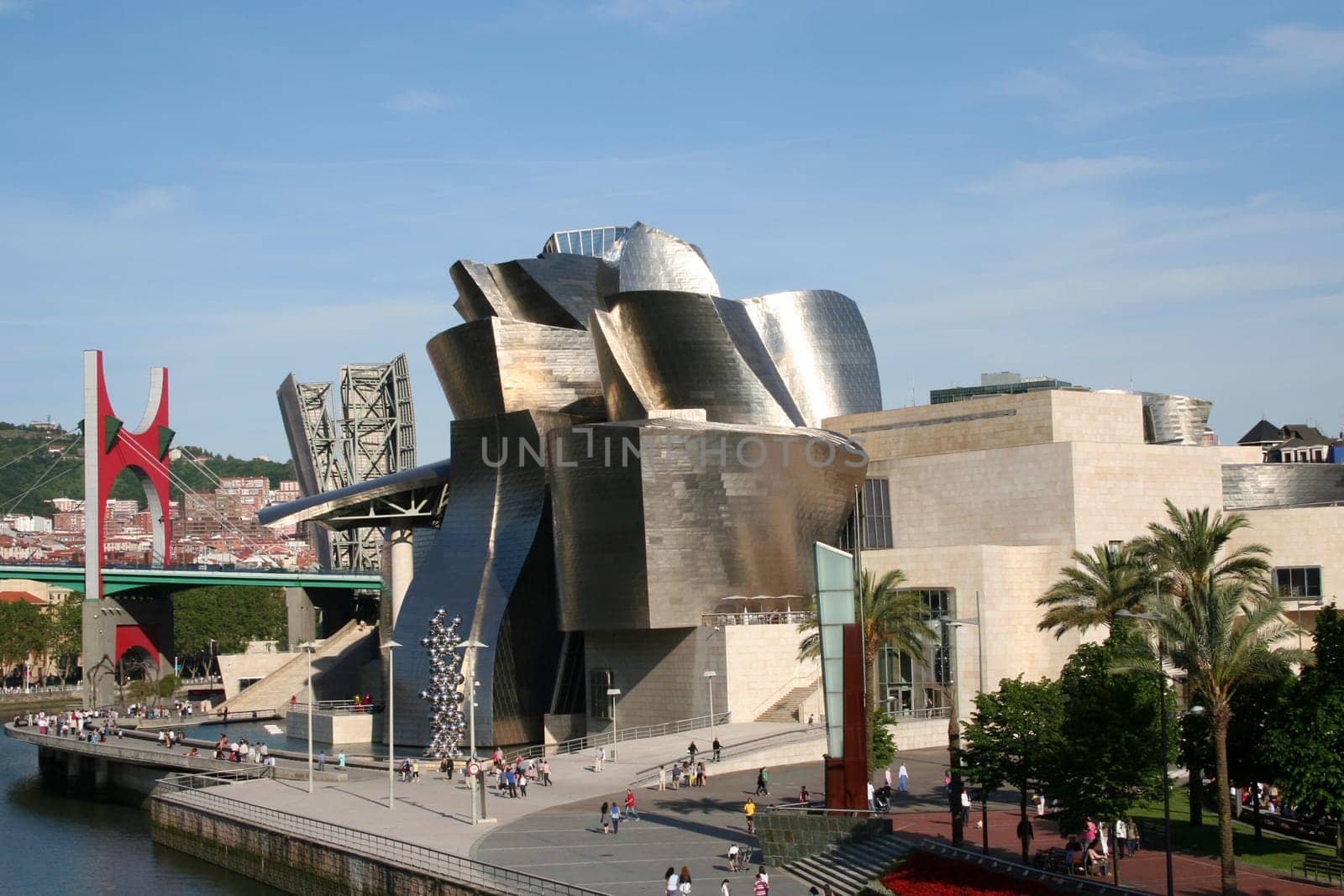 BILBAO, SPAIN - JULY 30: Exterior view of the Guggenheim Museum at sunset on July 30, 2011 in Bilbao, Spain. This Museum is dedicated exhibition of modern art and was designed by Frank Gehry.