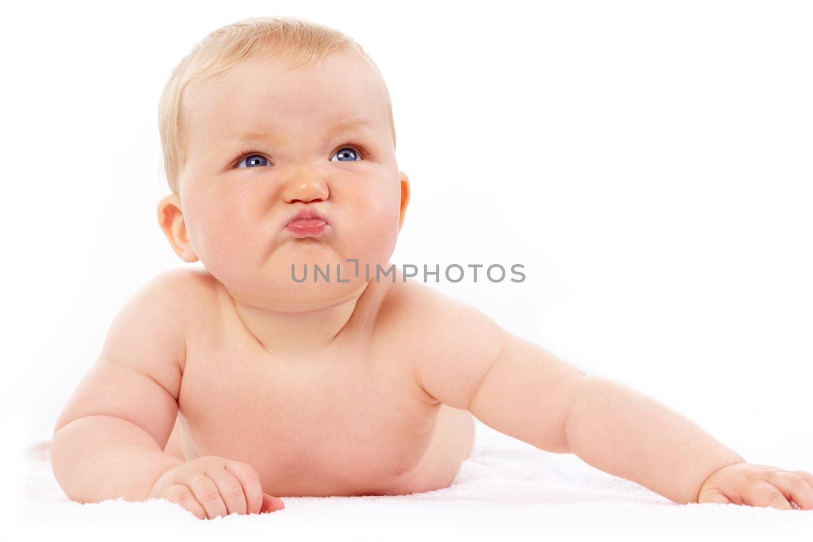Portrait of small girl with capricious expression looking upwards