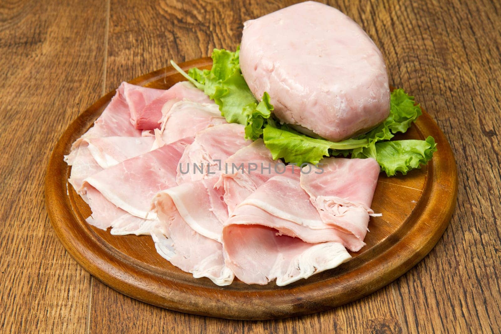 fresh ham on wooden board