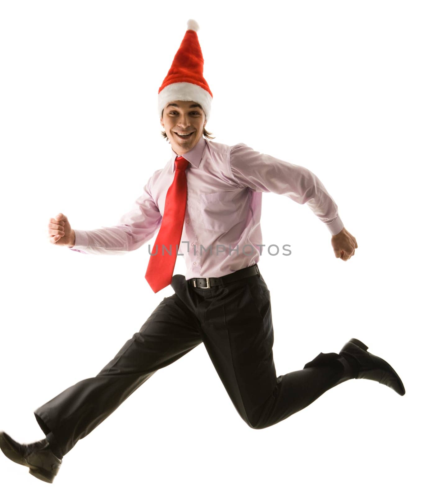 Full-size view of running santa looking at camera and smiling over white background