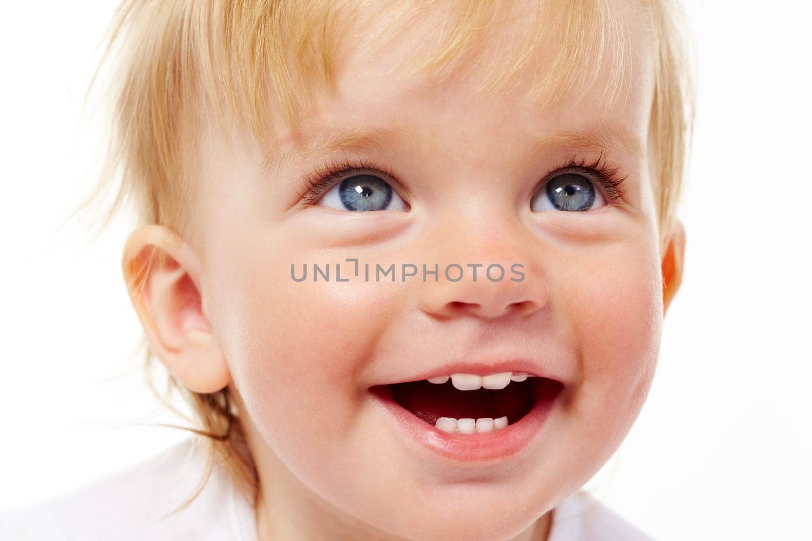 Portrait of cute child laughing in isolation