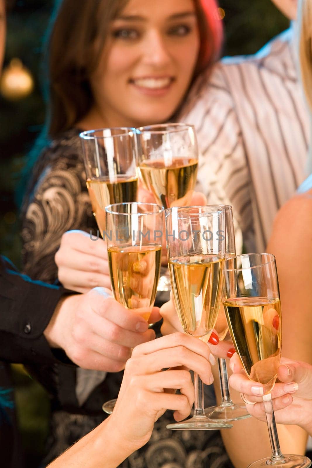 Group of champagne glasses clinking together