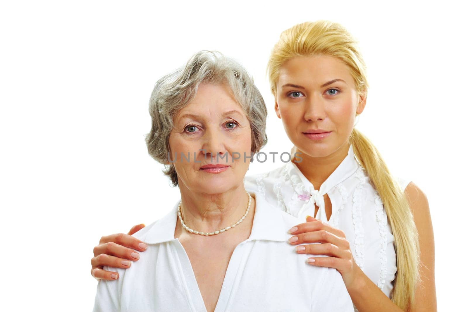 Portrait of attractive woman touching her old mother