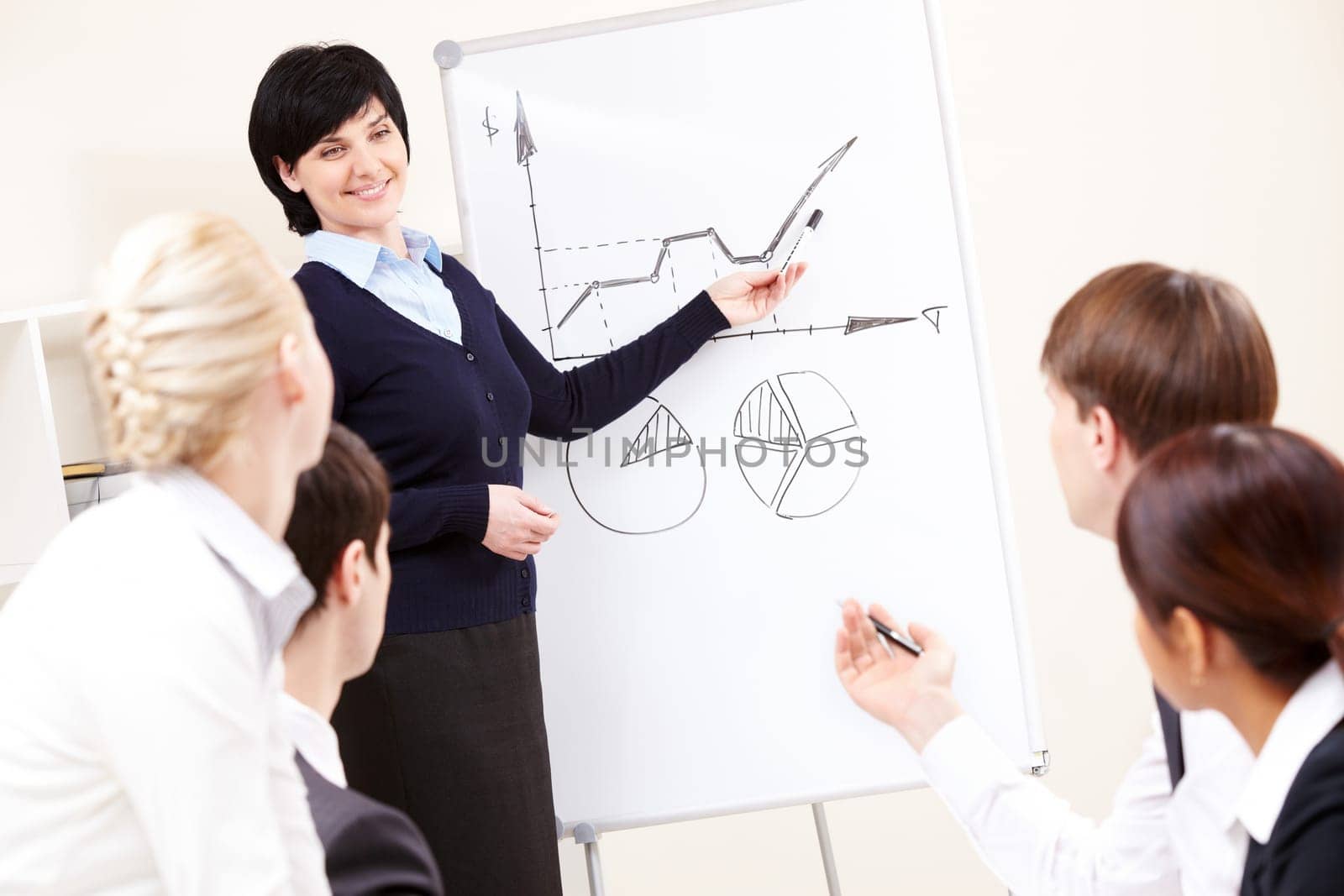 Image of confident woman making presentation and interacting with the audience