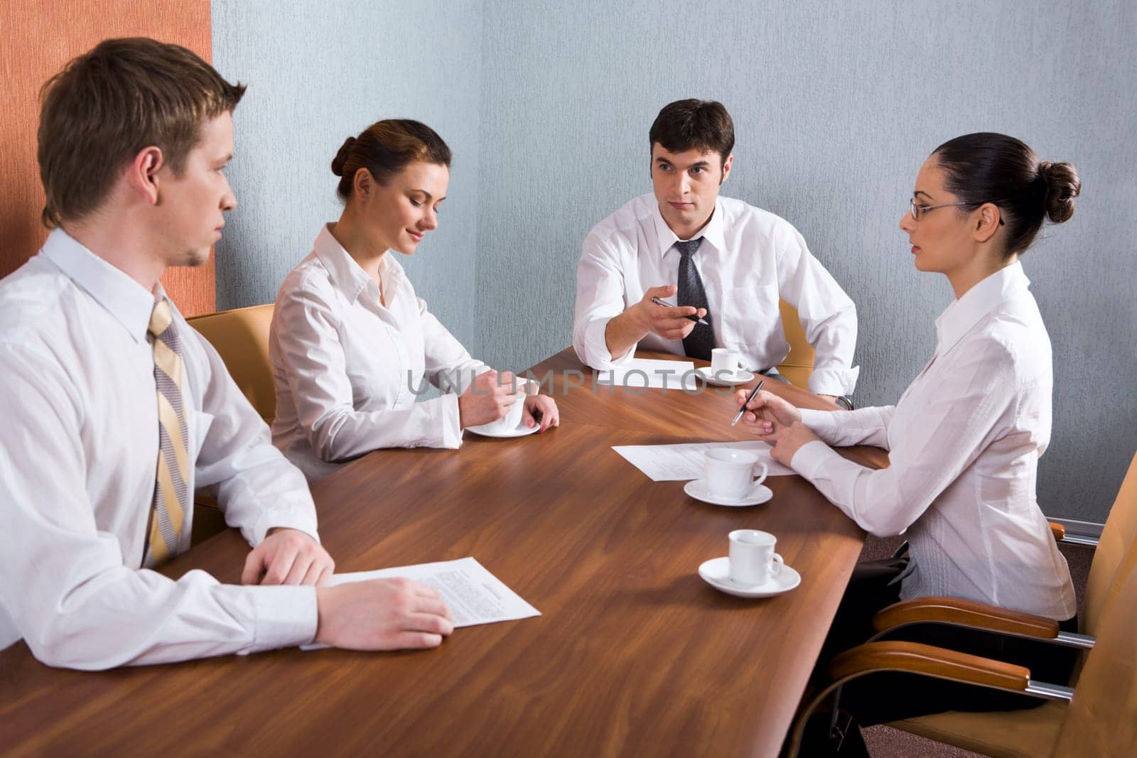 Group of young businessmen are discussing very important question