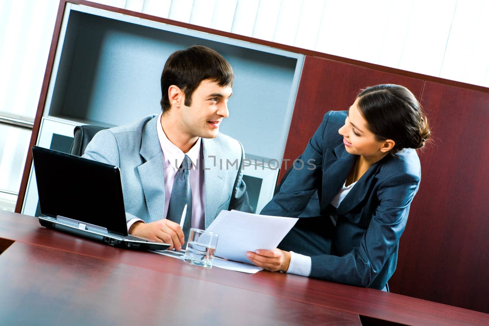 Portrait of two business people looking at each other during a work